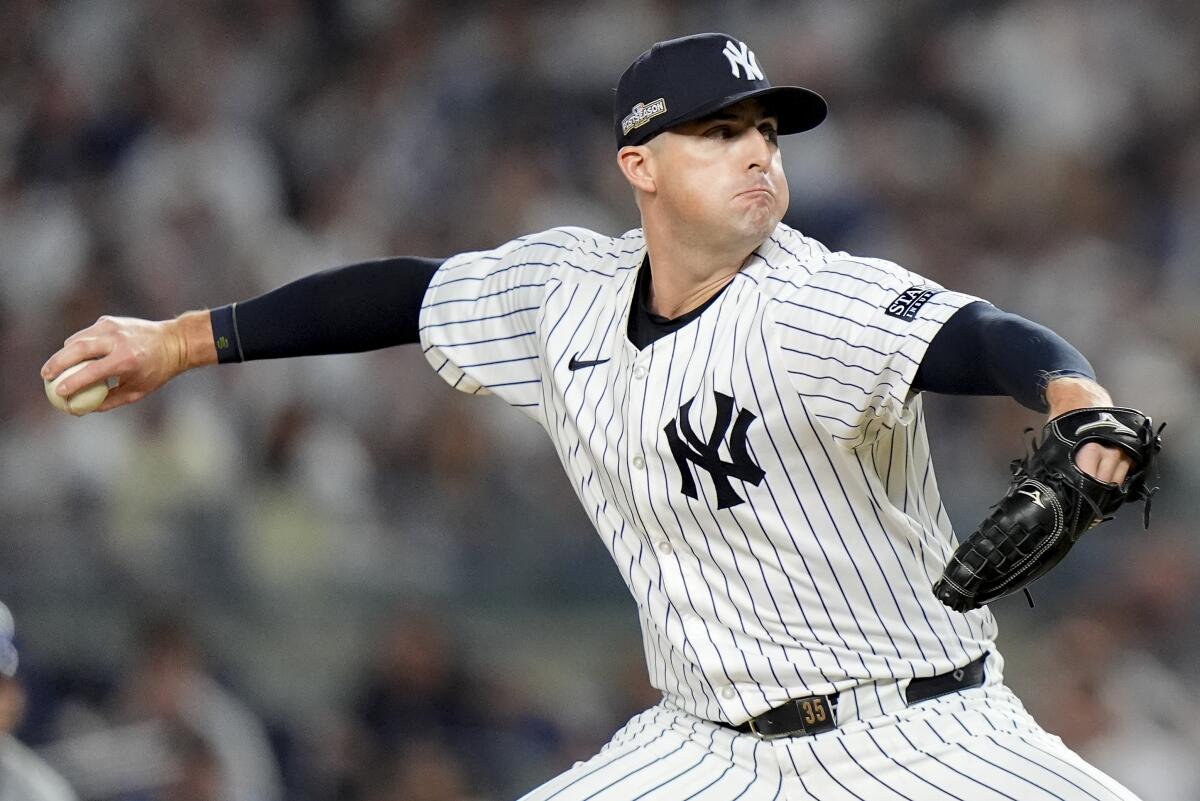 Yankees pitcher Clay Holmes delivers against the Kansas City Royals during the sixth inning of Game 1 of the ALDS.