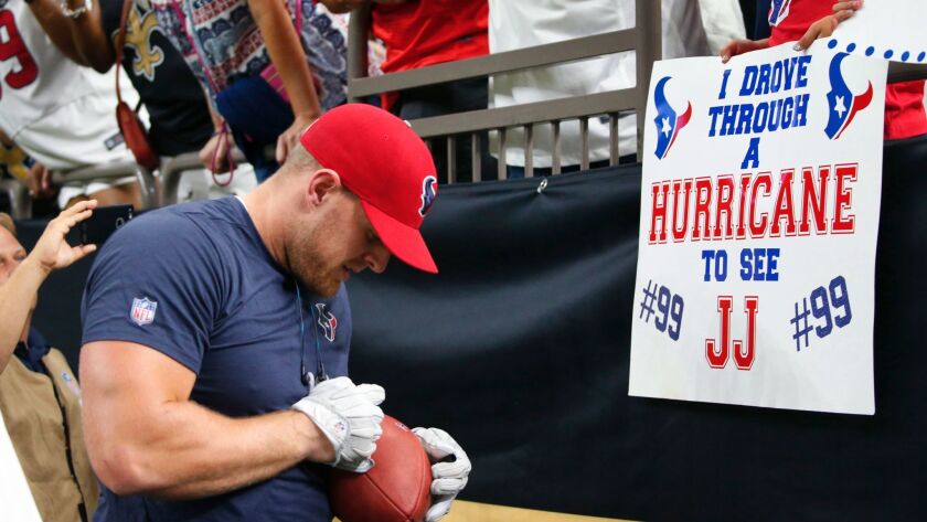 Houston Texans defensive end J.J. Watt signs autographs before an exhibition game against the New Orleans Saints on Aug. 26.