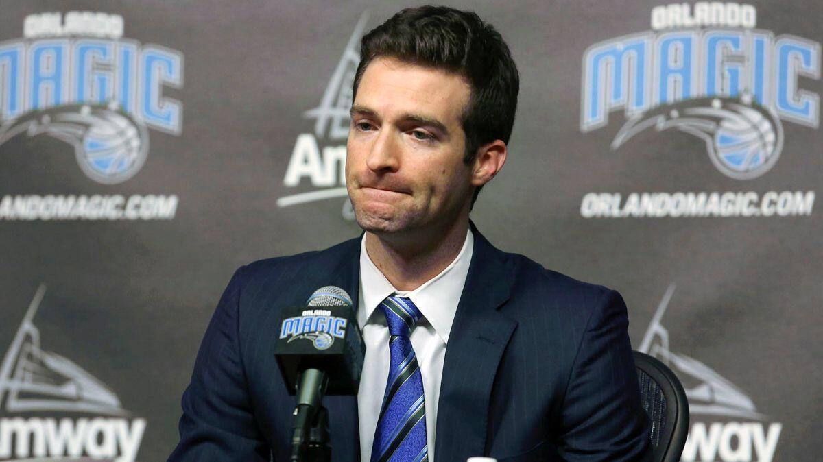 Orlando Magic general manager Rob Hennigan pauses to answer a question during a news conference in Orlando, Fla. Magic have fired Hennigan after missing the postseason for five straight seasons.