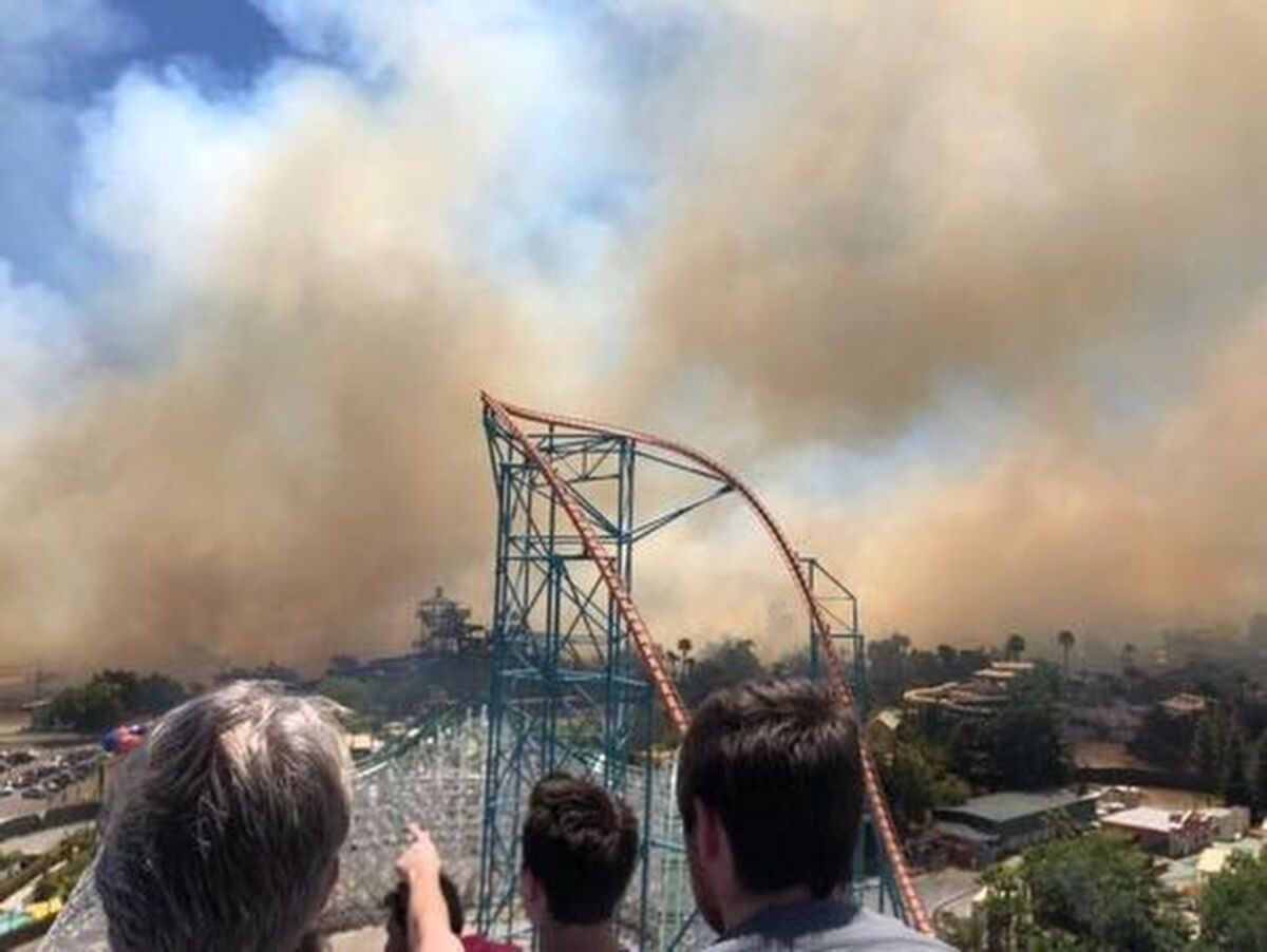A brush fire burns near Six Flags Magic Mountain in Valencia.