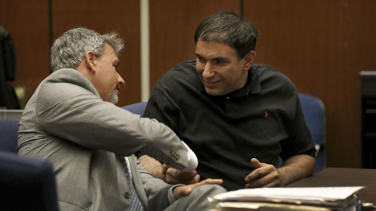 Attorney Glen Jonas celebrates with his client Emil Alseranai after he was granted a new trial by Judge Michael Garcia at the Clara Foltz Criminal Justice Center. Alseranai was convicted on drug charges last year.