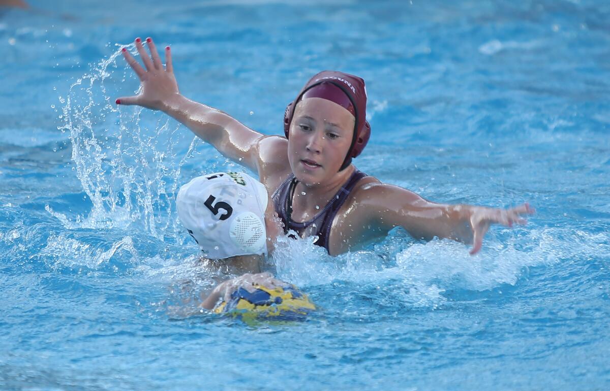 Nicole Struss, shown defending against Manhattan Beach Mira Costa on Friday, is a key player for the Laguna Beach High girls' water polo team.
