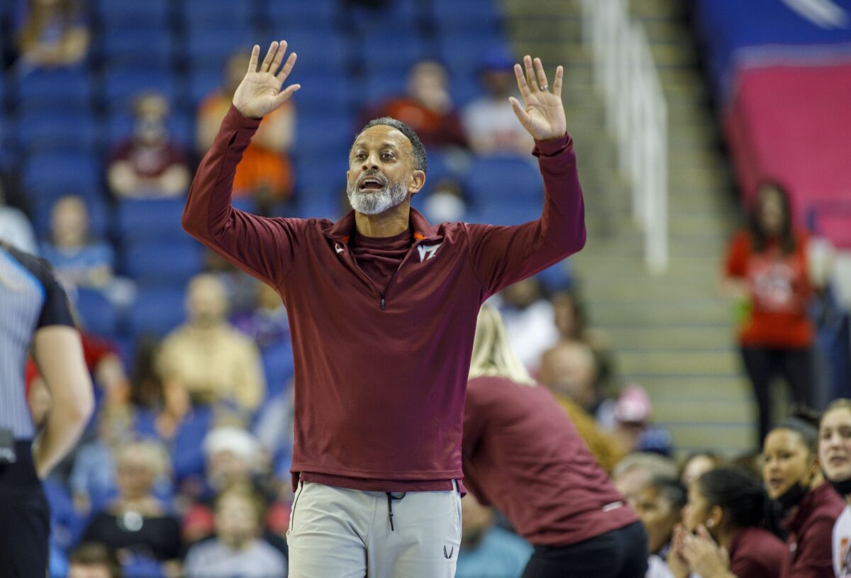 Virginia Tech head coach Kenny Brooks motions to his team during the first half of an NCAA college basketball game against North Carolina State in the semifinals of the Atlantic Coast Conference women's tournament in Greensboro, N.C., Saturday, March 5, 2022. (AP Photo/Lynn Hey)