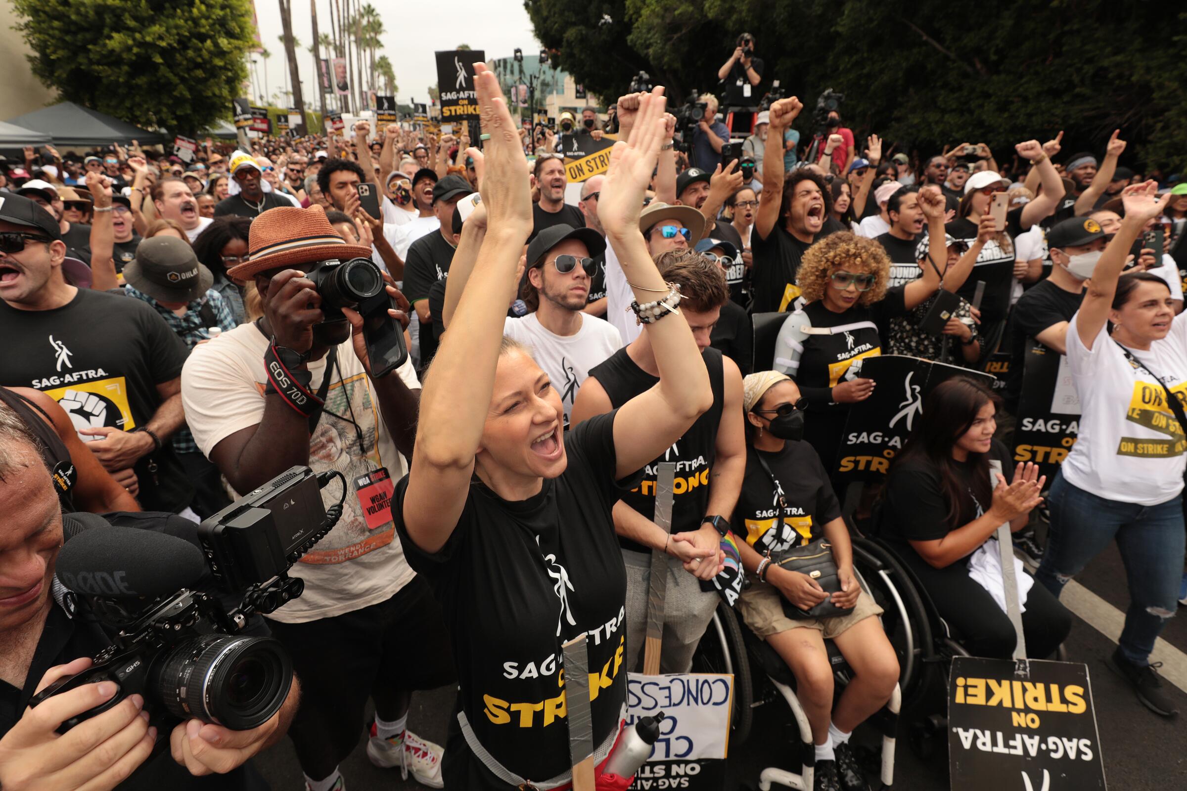 SAG-AFTRA members take to the picket line outside Netflix in Los Angeles.