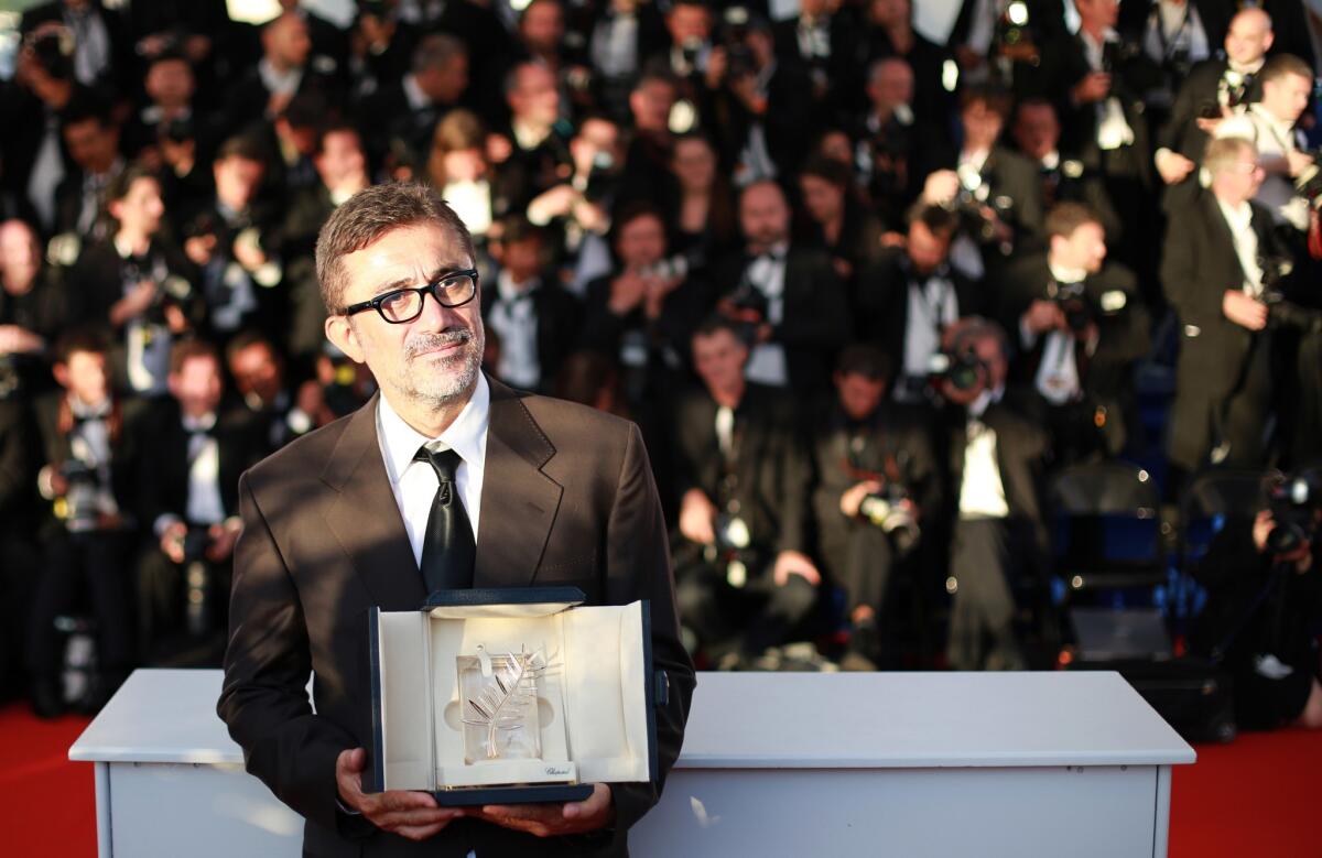 Turkish director Nuri Bilge Ceylan with the Palme d'Or he won for the film "Winter Sleep" at Cannes.