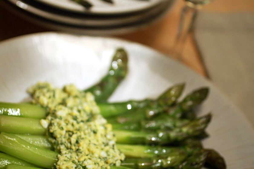 Minced hard-cooked eggs turn the vinaigrette creamy. Recipe: Asparagus in sauce mimosa