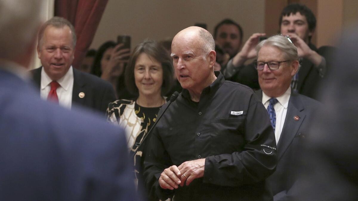 Gov. Jerry Brown stopped by the Senate Chambers to make a few remarks shortly before midnight on Aug. 31 in Sacramento.