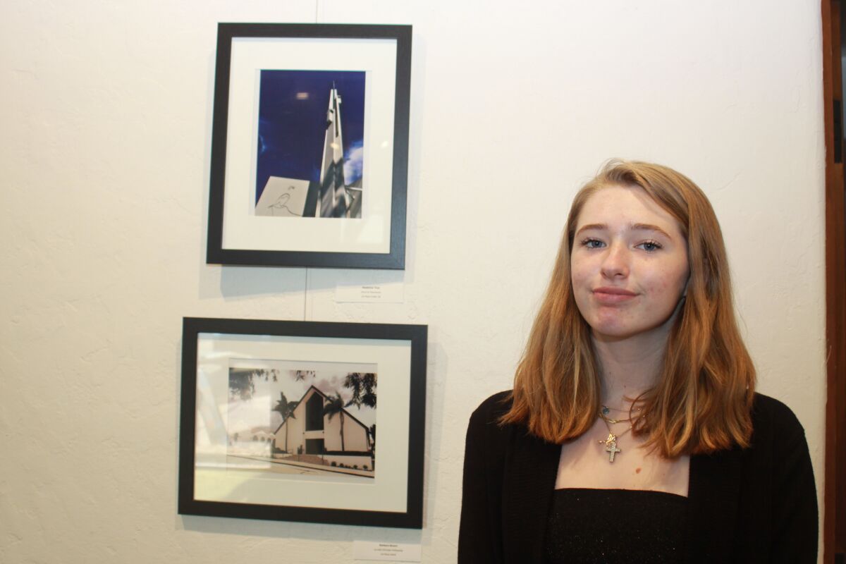Madeline Thiel, 15, stands next to her winning photo (top) of the Clairemont Lutheran Church at 4271 Clairemont Mesa Blvd.