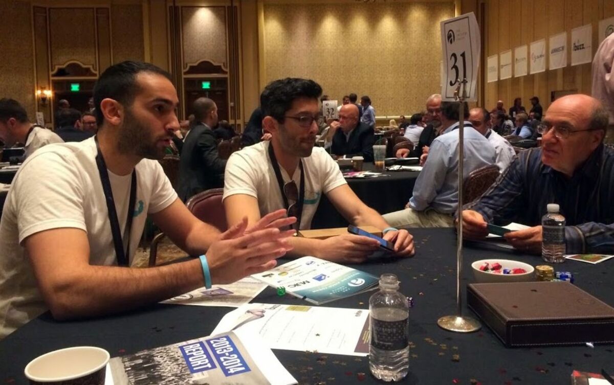 Nestdrop founders Roddy Radnia, left, and Michael Pycher pitch their concept for a user-friendly app to order marijuana and alcohol deliveries to investors at a marijuana business conference in Nevada.