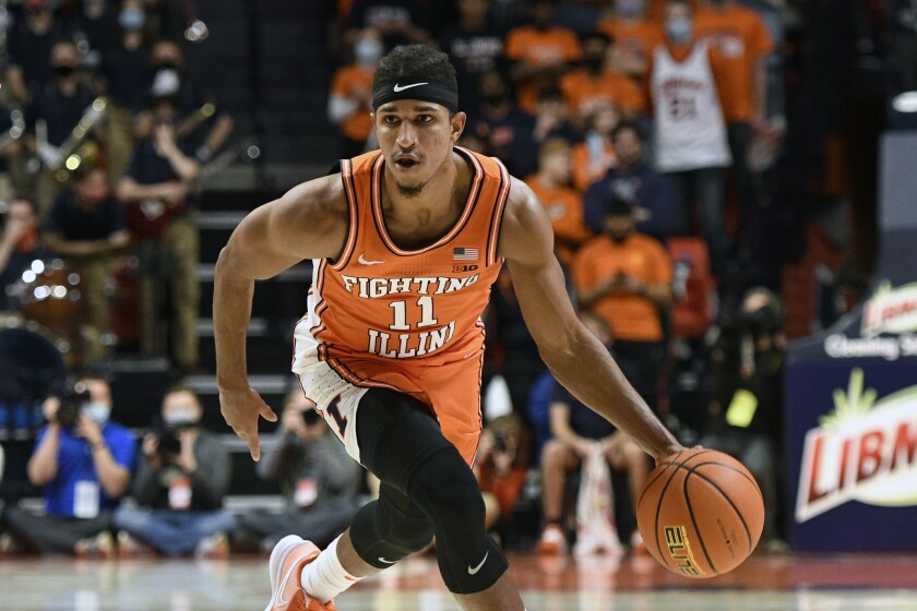 Illinois' Alfonso Plummer advances the ball during the first half of an NCAA college basketball game against Notre Dame Monday, Nov. 29, 2021, in Champaign, Ill. (AP Photo/Michael Allio)