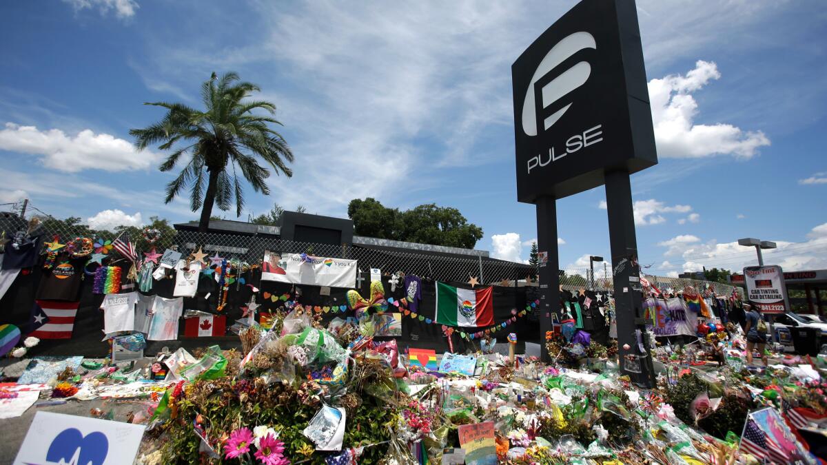 A makeshift memorial continuing to grow outside the Pulse nightclub in Orlando, Fla.