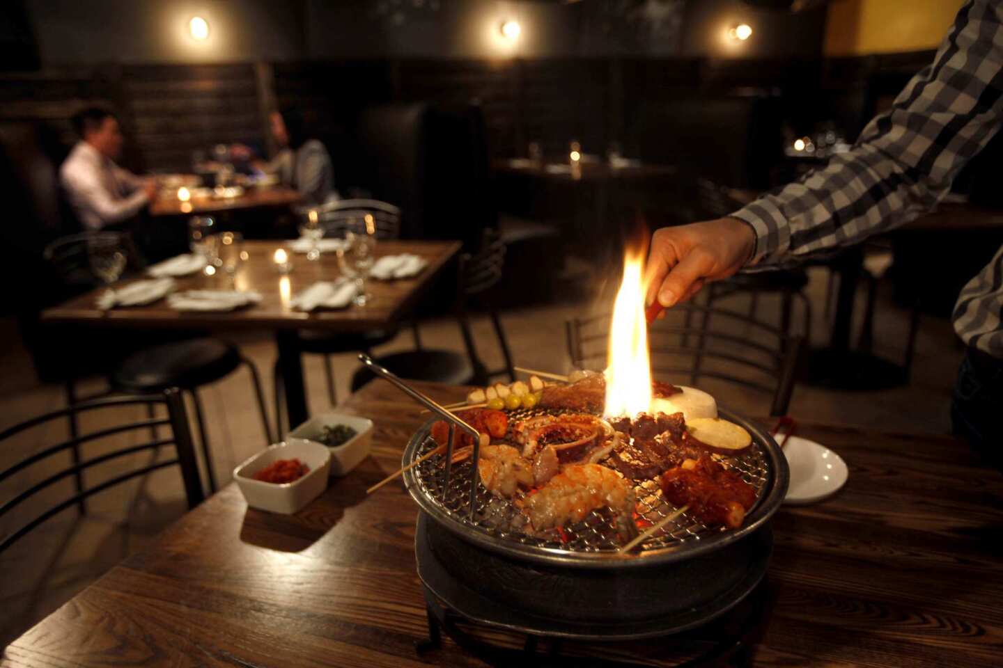 Korean barbecue is flamed tableside.