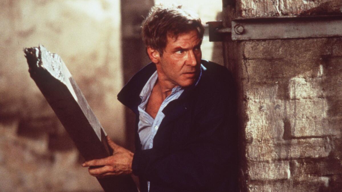 Harrison Ford as Jack Ryan in 1994's "Clear and Present Danger." The producers of Amazon's "Tom Clancy's Jack Ryan" said Ford’s version of the bookish and reluctant hero initially influenced their take of the character.