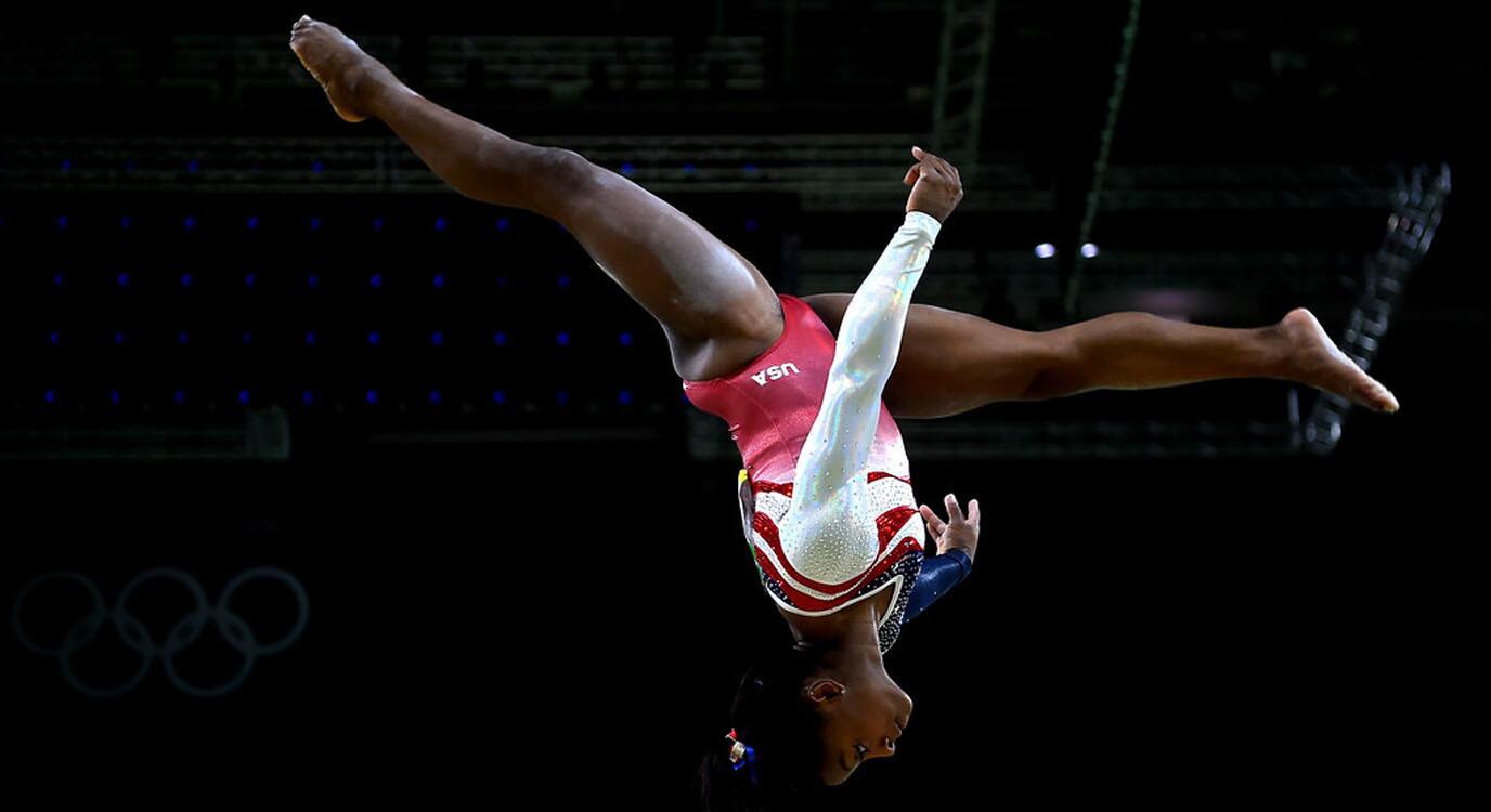 Simone Biles of the United States competes on the balance beam during the Artistic Gymnastics Women's Team Final at the Rio Olympic Arena in Rio de Janeiro, Brazil.