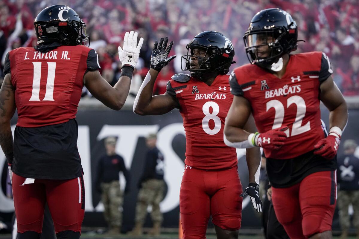 Cincinnati wide receiver Michael Young Jr. (8) celebrates after scoring a touchdown during the second half Nov. 6, 2021.