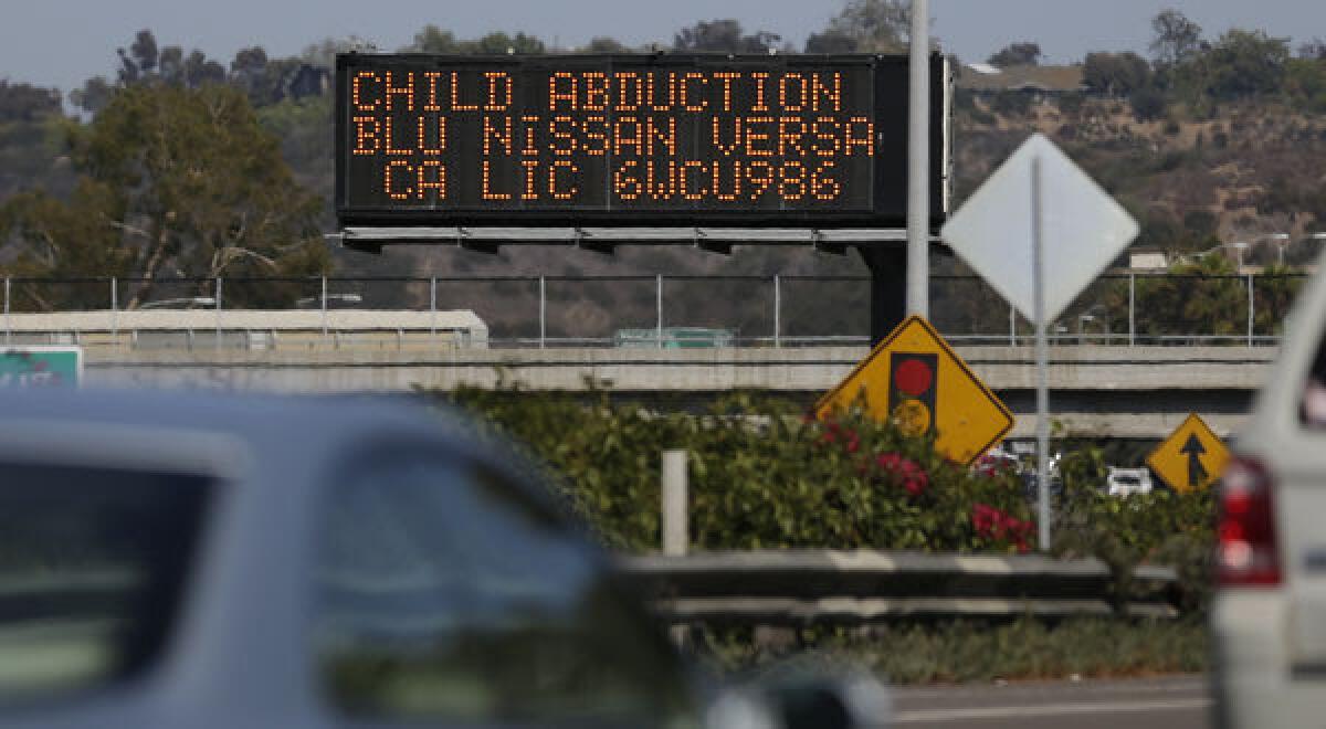 Drivers pass a display in San Diego showing an Amber Alert, asking motorists to be on the lookout for a vehicle.
