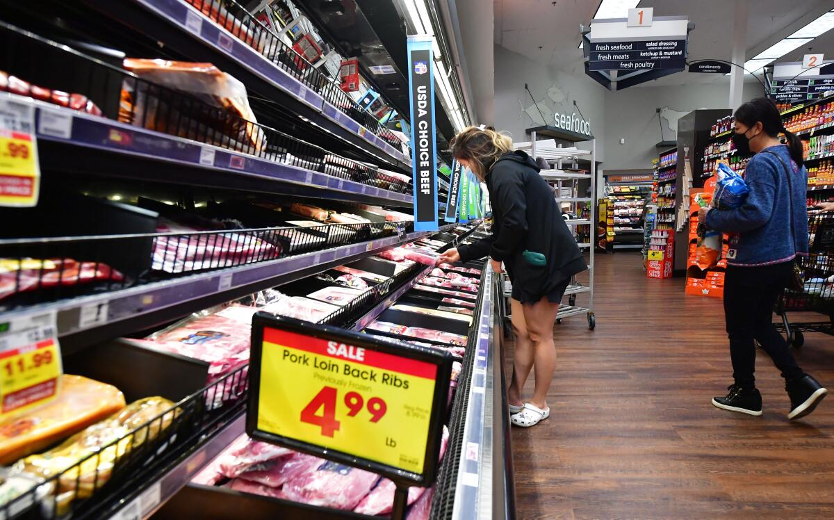 People shop at a grocery store in Monterey Park, California