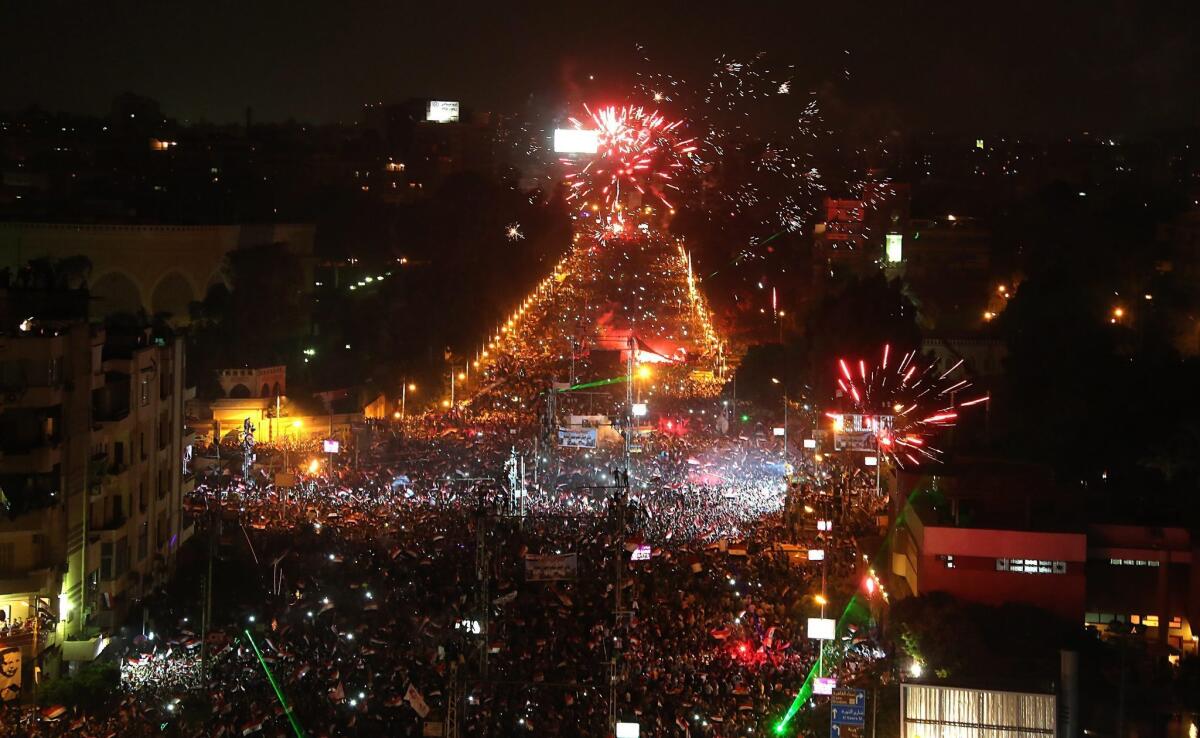 Opponents of ousted Egyptian President Mohamed Morsi celebrate outside the presidential palace in Cairo.