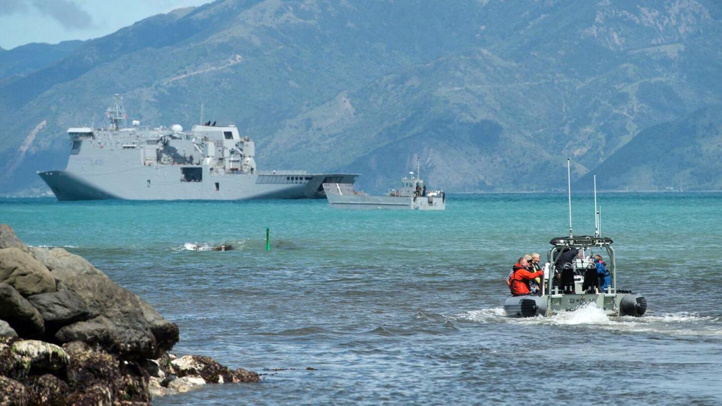 This handout photo from the New Zealand Defence Force taken and received on Nov. 16, 2016, shows stranded tourists being evacuated from Kaikoura to a naval ship after an earthquake hit New Zealand two days earlier.