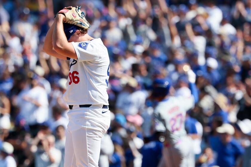 LOS ANGELES, CALIFORNIA - OCTOBER 14: Landon Knack #96 of the Los Angeles Dodgers reacts after giving up a grand slam to Mark Vientos #27 of the New York Mets during the second inning in game two of the National League Championship Series at Dodger Stadium on Monday, Oct. 14, 2024 in Los Angeles. (Robert Gauthier / Los Angeles Times)