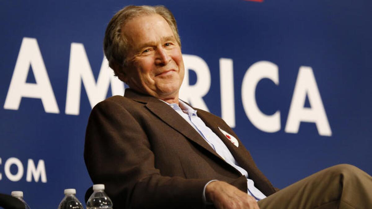George W. Bush enjoys the moment.