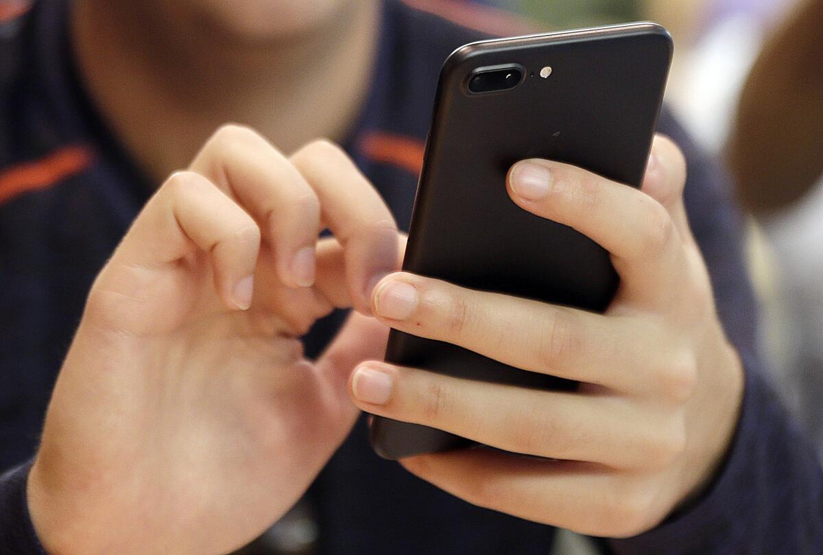 A person uses a smartphone.