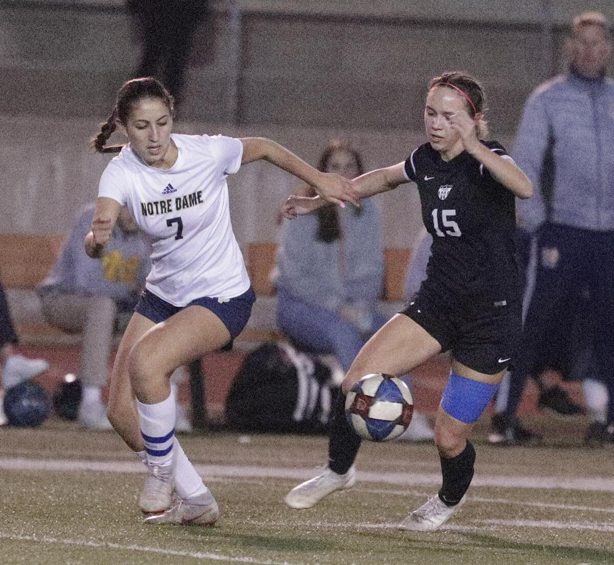 Flintridge Sacred Heart's Lauren Bolte dribbles with the ball with Sherman Oaks Notre Dame's Kiana Kazadzis giving chase in a Mission League girls' soccer game at Occidental College in Los Angeles on Wednesday, January 8, 2020.