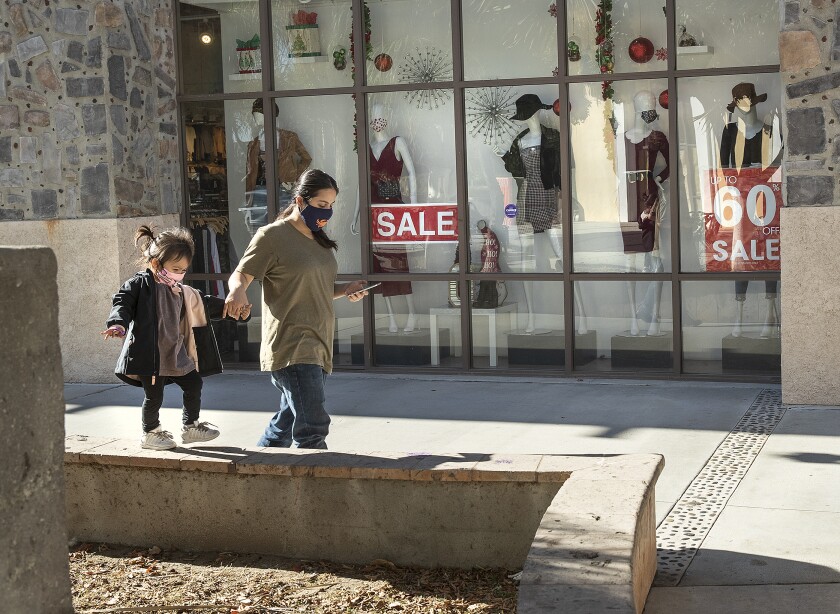 Anabel Garcia, left, walks with her aunt Sucelly Morales while visiting Plaza Mexico in Lynwood