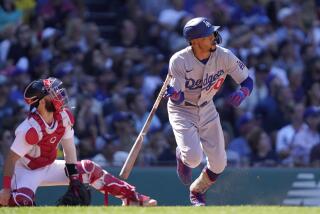 Los Angeles Dodgers' Mookie Betts, right, watches the flight of his two-run home run.