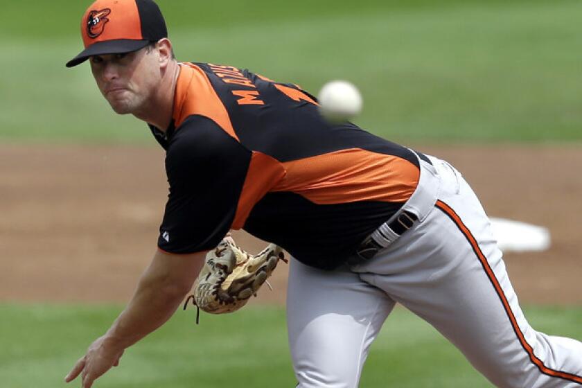 Orioles starter Brian Matusz delivers a pitch against the Red Sox during a spring training game.