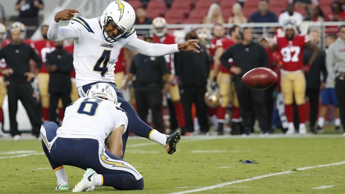 Chargers kicker Roberto Aguayo (4) kicks a field goal from the hold of Drew Kaser against the San Francisco 49ers during the first half of a preseason game on Thursday.