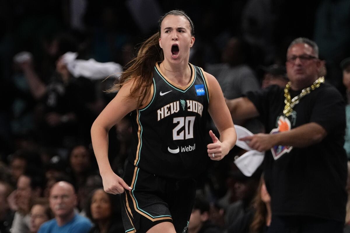 New York's Sabrina Ionescu celebrates a basket during Game 3 of the WNBA Finals on Sunday.