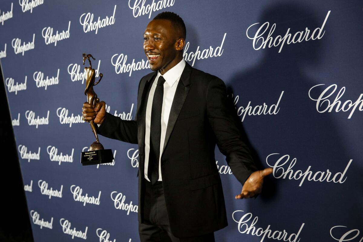 Mahershala Ali backstage at the 28th annual Palm Springs International Film Festival awards gala with his "Breakthrough Performance Award" for his work in "Moonlight."