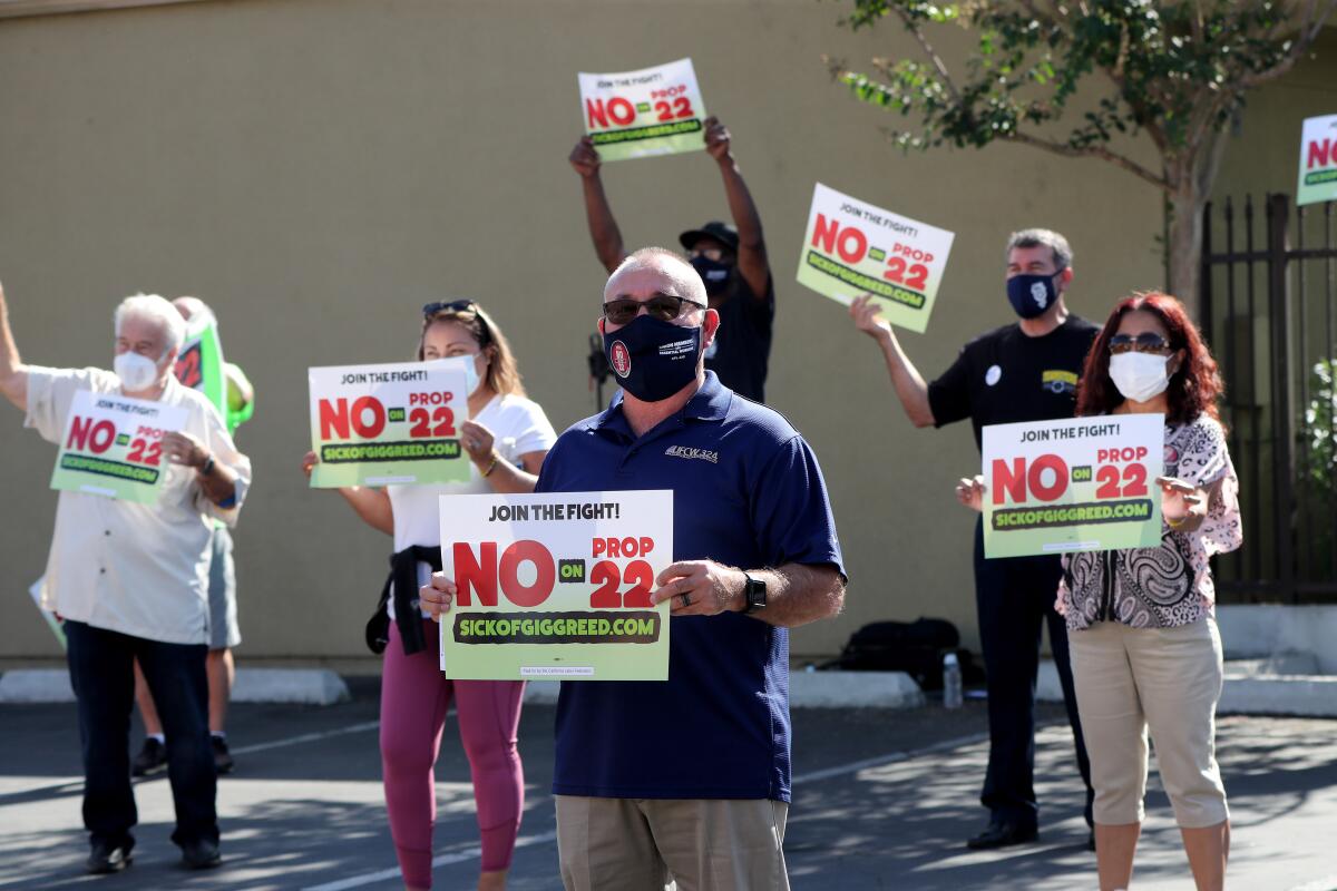Car rally in Orange County rails against Proposition 22 - Los Angeles Times