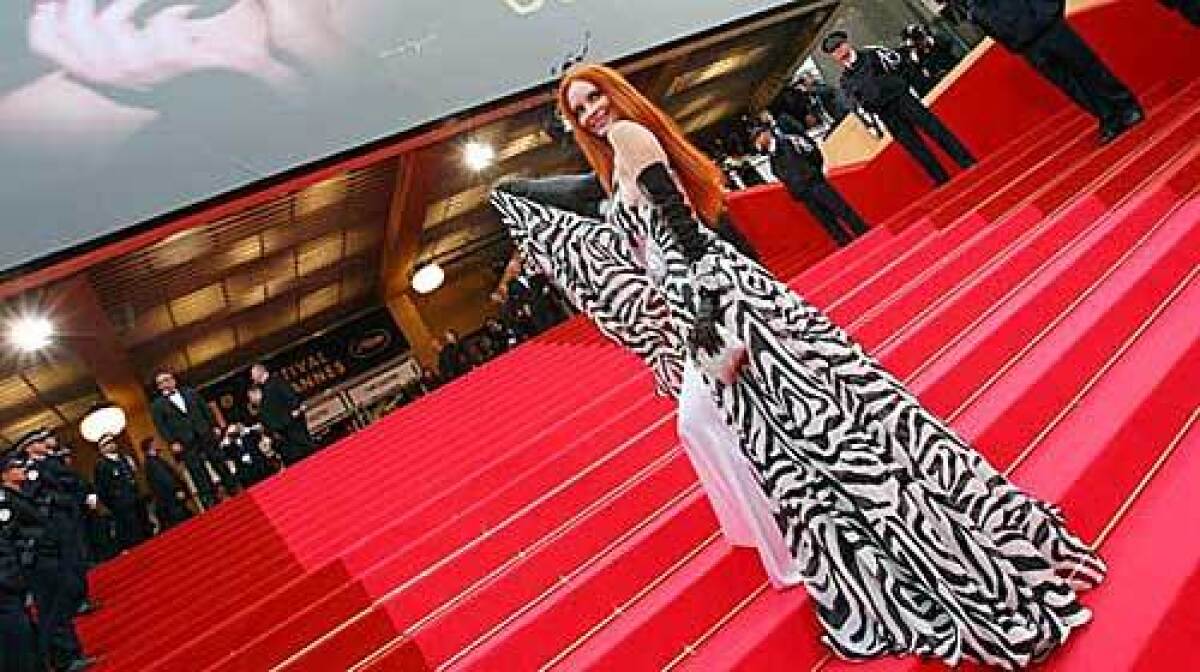Phoebe Price in a floor-length black and white gown at the screening of Woody Allen's new film.