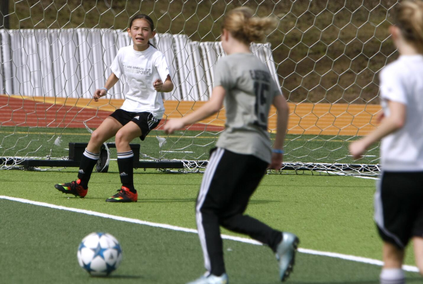 Paradise Canyon Elementary School fifth grader Montana Labarge, on goal at left, organized Kick 4 a Cure at the La Cañada High School soccer field in La Cañada Flintridge on Saturday, March 4, 2017. The event was a two-hour soccer game fundraiser to raise money for breast cancer research at the City of Hope.