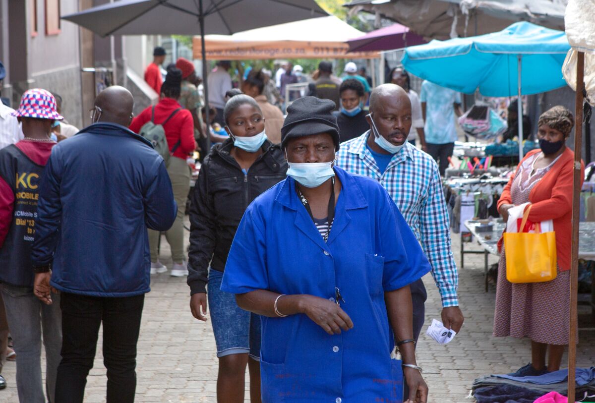 A woman, wearing a mask to protect against COVID-19 in Soweto, South Africa