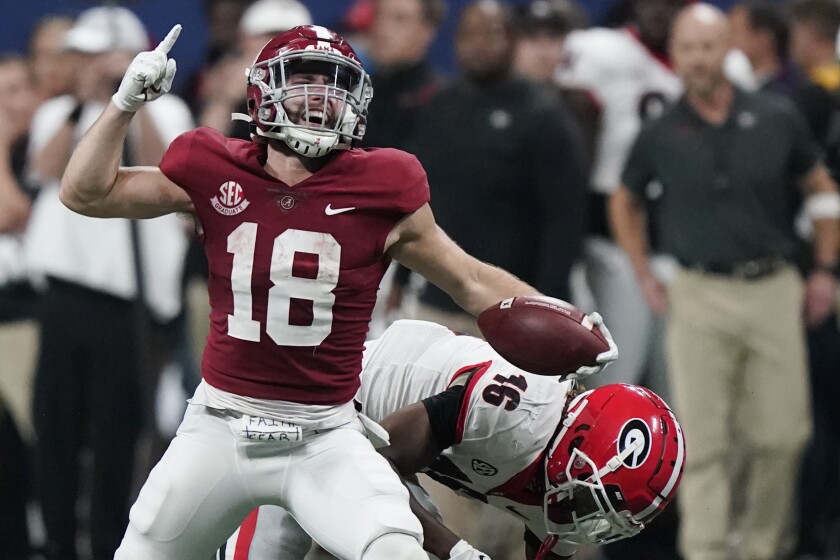 Alabama wide receiver Slade Bolden (18) celebrates during the second half of the Southeastern Conference championship NCAA college football game against Georgia, Saturday, Dec. 4, 2021, in Atlanta. Alabama won 41-24. (AP Photo/Brynn Anderson)