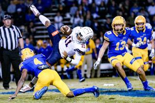 The Bishop Amat player upending Chaminade QB Seth Shigg is defensive back Foster Slaughter.