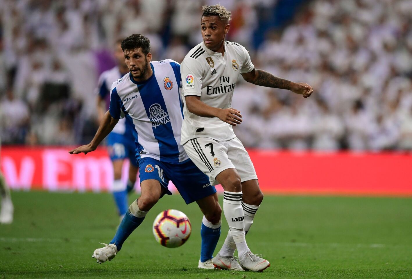 Espanyol's Spanish defender Javier Lopez (L) vies with Real Madrid's Spanish-Dominican forward Mariano during the Spanish league football match between Real Madrid CF and RCD Espanyol at the Santiago Bernabeu stadium in Madrid on September 22, 2018. (Photo by JAVIER SORIANO / AFP)JAVIER SORIANO/AFP/Getty Images ** OUTS - ELSENT, FPG, CM - OUTS * NM, PH, VA if sourced by CT, LA or MoD **