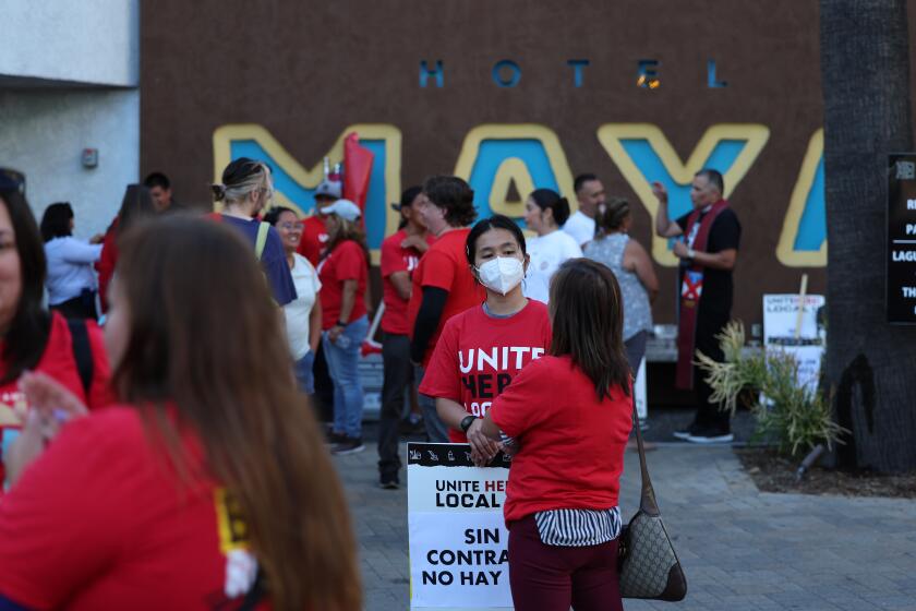Long Beach, CA - August 11: Previously striking workers protest at Hotel Maya in Long Beach Friday, Aug. 11, 2023. Hotel workers with Unite Here Local 11 are demanding higher wages, Hotel Maya workers walked off the job a week ago.(Allen J. Schaben / Los Angeles Times)