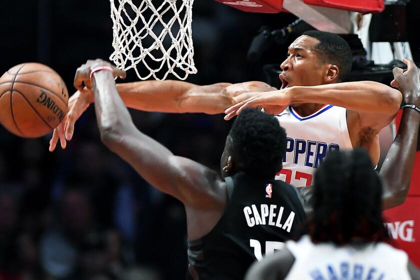 Clippers' Wesley Johnson blocks the shot of Houston Rockets' Clint Capela in the second quarter.