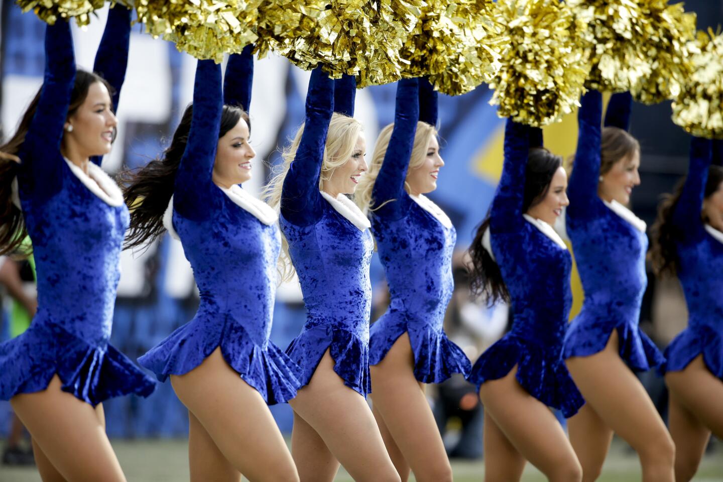 San Diego Charger's cheerleaders perform during the first half in an NFL football game against the Miami Dolphins Sunday, Dec. 20, 2015, in San Diego. (AP Photo/Gregory Bull)