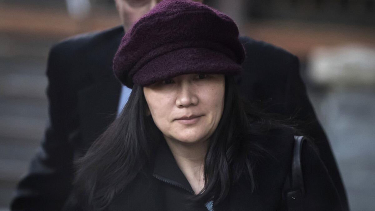 Meng Wanzhou, Huawei chief financial officer, leaves her home to attend a court appearance in Vancouver, Canada.