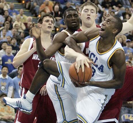 Luc Richard Mbah A Moute gets fouled by Washington State Aron Baynes as he drives to the basket.
