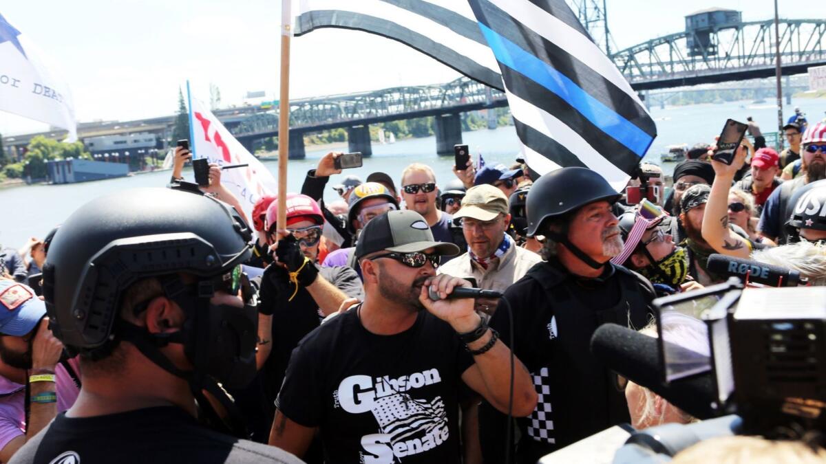 Patriot Prayer leader Joey Gibson speaks Saturday during the rally in Portland.