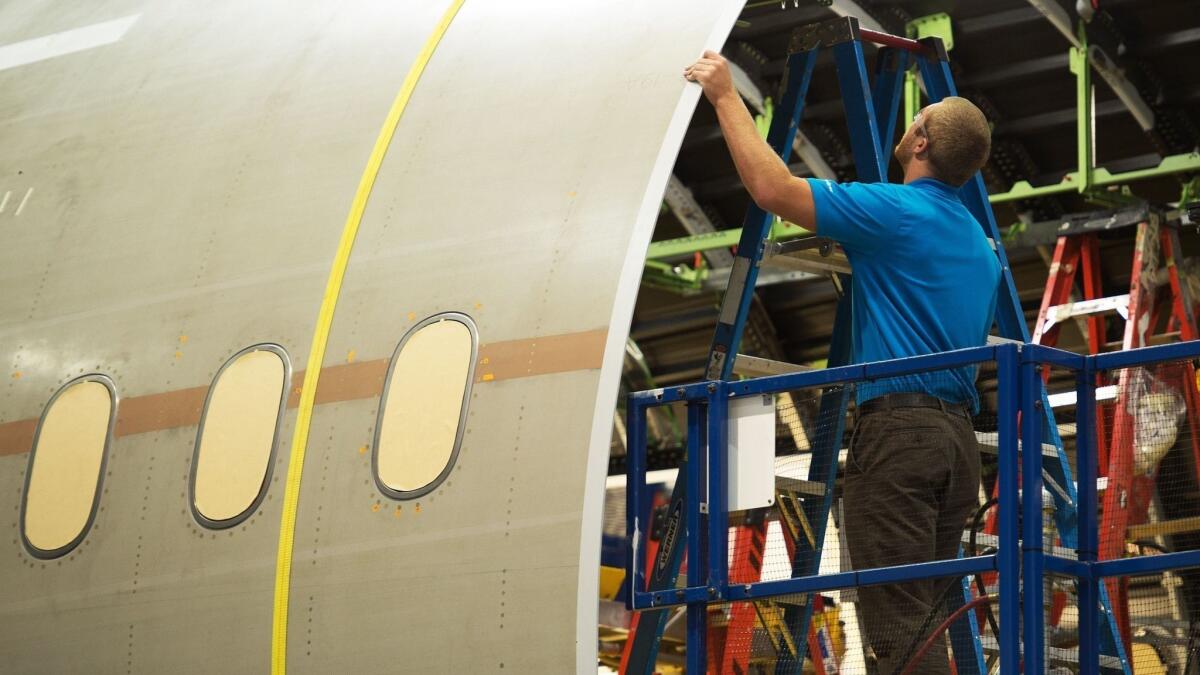 A Boeing employee works on a 787 Dreamliner at the company's factory in South Carolina.