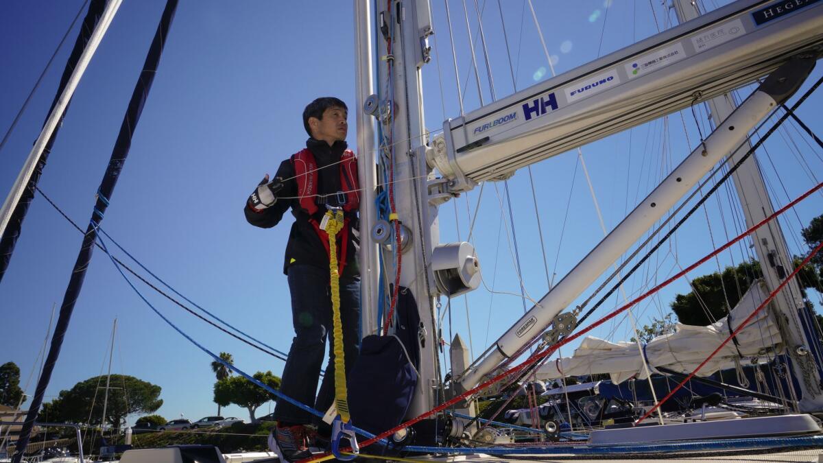Mitsuhiro "Hiro" Iwamoto prepares the main sail of the Dream Weaver before leaving on a test sail outside San Diego Bay. Iwamoto, who is blind, and Doug Smith plan to sail from San Diego to Japan nonstop this winter.