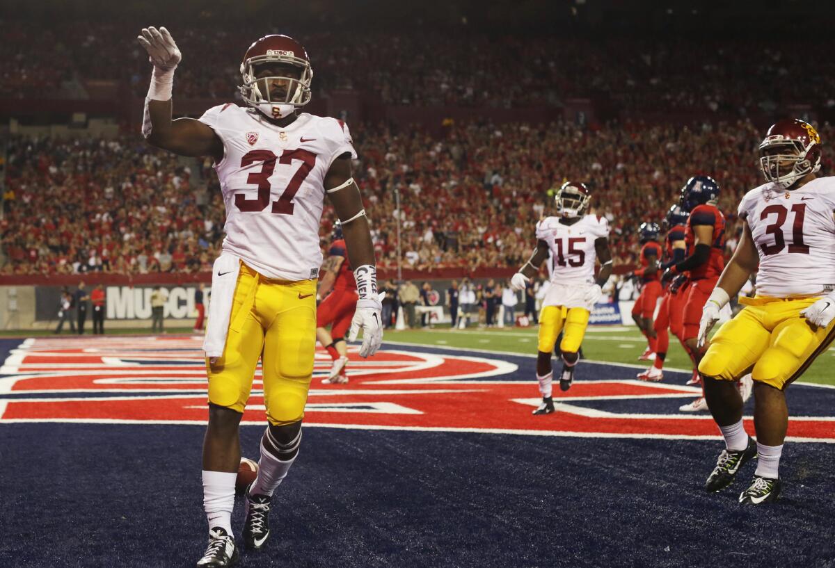 USC running back Javorius Allen strikes a pose after scoring on a 48-yard touchdown run against Arizona on Oct. 11. Allen has rushed for 1,244 yards with nine touchdowns.