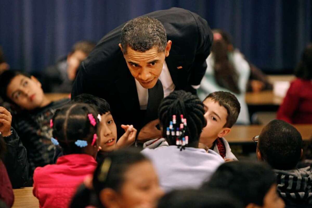 President Obama is seen visiting a school in Maryland. Congress is considering several education bills this year.